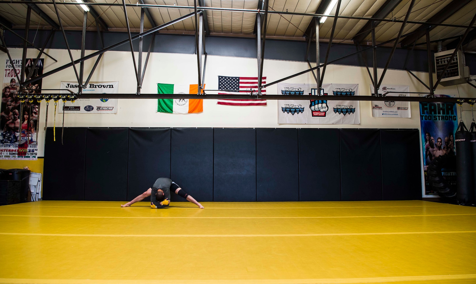 Airman 1st Class Raul Veliz, 90th Missile Security Forces Squadron response force leader, stretches before training at Trials Mixed Martial Arts gym in Fort Collins, Colo., May 5, 2017. Veliz makes the hour trip to Colorado four days a week to train. He is stationed at F.E. Warren Air Force Base, Wyo. (U.S. Air Force photo by Staff Sgt. Christopher Ruano)
