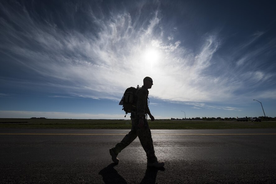 A 90th Security Forces Group defender participates in a ruck march during Police Week at F.E. Warren Air Force Base, Wyo., May 17, 2017. The march was six miles long and more than 50 security forces members participated in the event. (U.S. Air Force photo by Staff Sgt. Christopher Ruano)