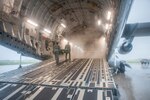 U.S. Air Force Airmen from the 18th Aerospace Evacuation Squadron load equipment into a C-17 Globemaster III May 13, 2017, at Kadena Air Base, Japan. The 18th AES maintains a forward presence and supports medical contingencies in the Pacific to include the only neonatal air facility in the region.
