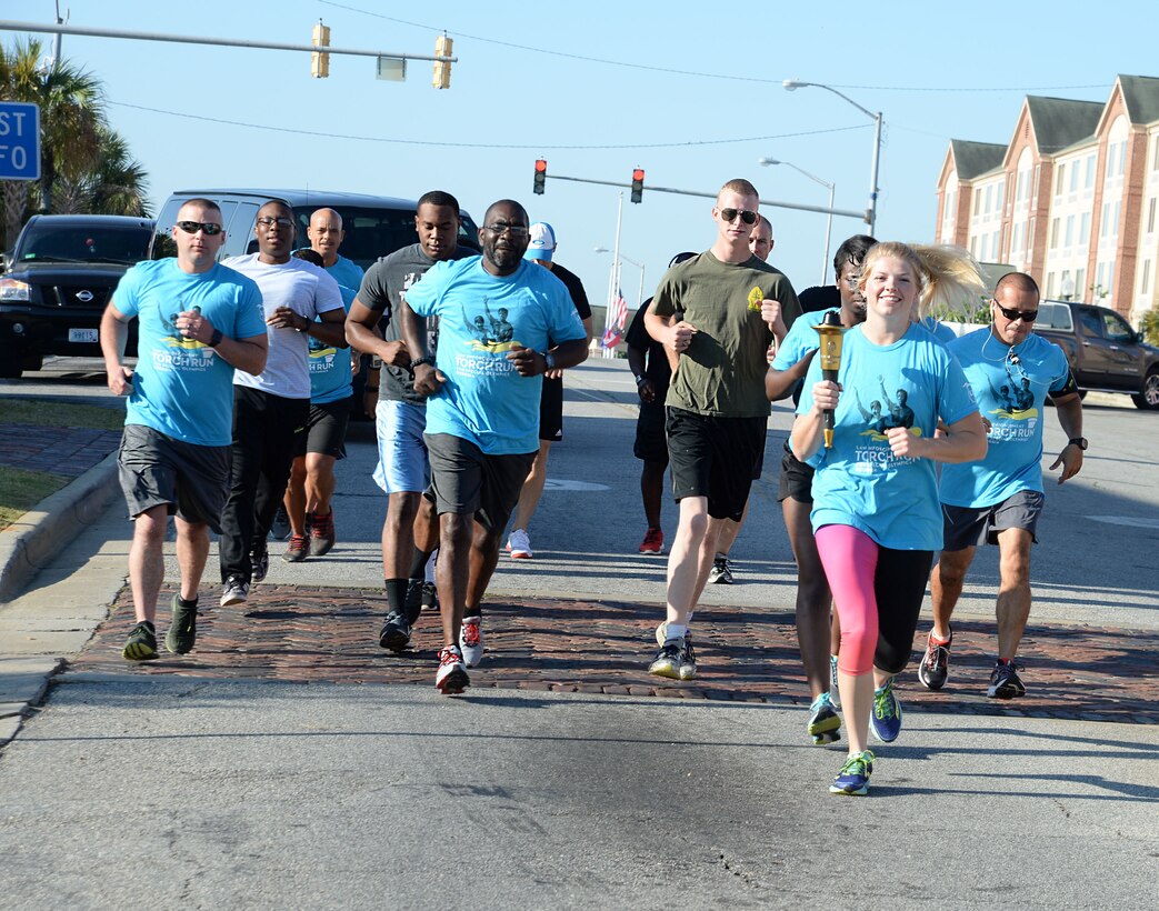 Marine Corps Logistics Base Albany police officers and active-duty service members represent the installation at Albany-Dougherty County’s annual 2017 Georgia Law Enforcement Torch Run for Special Olympics, May 16. Lt. Delaney Bourlakov, adjutant, MCLB Albany, carried the ceremonial torch and led the run with fellow-Marine comrades and Marine Corps Police Department personnel in the early morning kickoff and the 5k run, which followed. The day’s activities were held to commemorate the annual Law Enforcement Memorial Week, the Torch Run for Special Olympics and to honor fallen officers.