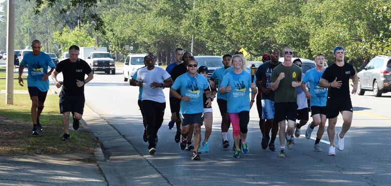 Marine Corps Logistics Base Albany police officers and active-duty service members represent the installation at Albany-Dougherty County’s annual 2017 Georgia Law Enforcement Torch Run for Special Olympics, May 16. Lt. Delaney Bourlakov, adjutant, MCLB Albany, carried the ceremonial torch and led the run with fellow-Marine comrades and Marine Corps Police Department personnel in the early morning kickoff and the 5k run, which followed. The day’s activities were held to commemorate the annual Law Enforcement Memorial Week, the Torch Run for Special Olympics and to honor fallen officers.