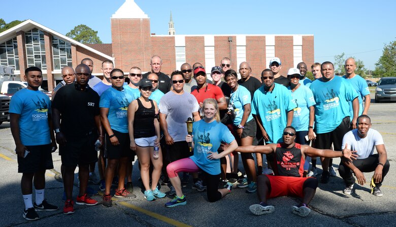 Marine Corps Logistics Base Albany police officers and active-duty service members represent the installation at Albany-Dougherty County’s annual 2017 Georgia Law Enforcement Torch Run for Special Olympics, May 16. Lt. Delaney Bourlakov, adjutant, MCLB Albany, carried the ceremonial torch and led the run with fellow-Marine comrades and Marine Corps Police Department personnel in the early morning kickoff and the 5k run, which followed. The day’s activities were held to commemorate the annual Law Enforcement Memorial Week, the Torch Run for Special Olympics and to honor fallen officers.