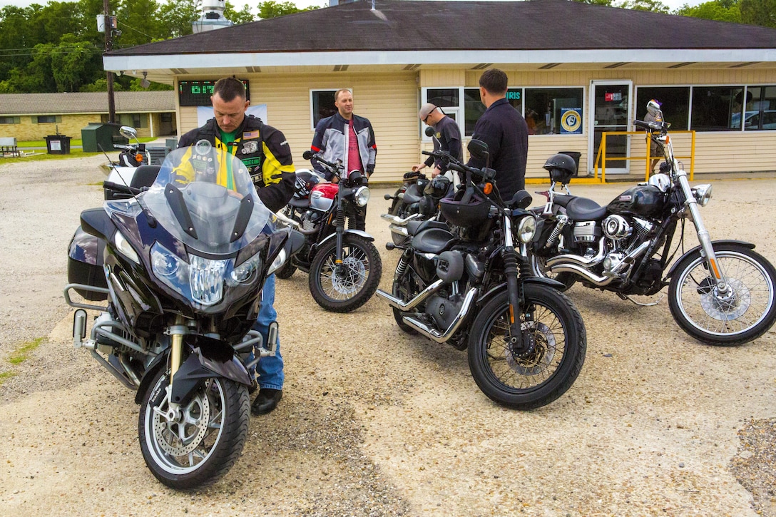 Marines with the Marine Corps Support Facility New Orleans Motorcycle Safety Mentorship Program gather outside Swamp Bar and Grill in Thibodaux, Louisiana, May 17, 2017. The Marine Corps Support Facility New Orleans Motorcycle Safety Mentorship Program, organized the 123 mile ride to help Marines improve their riding skills. (U.S. Marine Corps photo by Pfc. Melany Vasquez / Released)