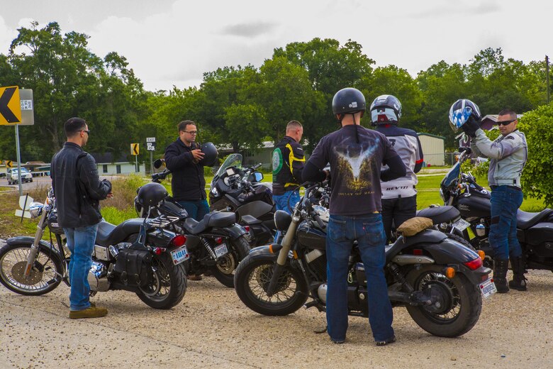Marines with the Marine Corps Support Facility New Orleans Motorcycle Safety Mentorship Program talk about their riding experience outside of the Swamp Bar and Grill in Thibodaux, Louisiana, May 17, 2017. The Marine Corps Support Facility New Orleans Motorcycle Safety Mentorship Program, organized a 123 mile ride to teach Marines how to ride their motorcycle through various roads. (U.S. Marine Corps photo by Pfc. Melany Vasquez / Released)