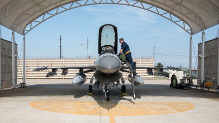 U.S. Air Force Airman 1st Class AJ Kovacs, a 14th Aircraft Maintenance Unit crew chief, talks to U.S. Air Force Capt. Jacob Impellizzeri, a 14th Fighter Squadron F-16 Fighting Falcon fighter pilot, before take-off at Kunsan Air Base, Republic of Korea, May 16, 2017. Team Misawa will have integrated with the 35th and 80th Fighter Squadron’s daily operations, to maintain readiness and proficiency and utilize unique training opportunities. 