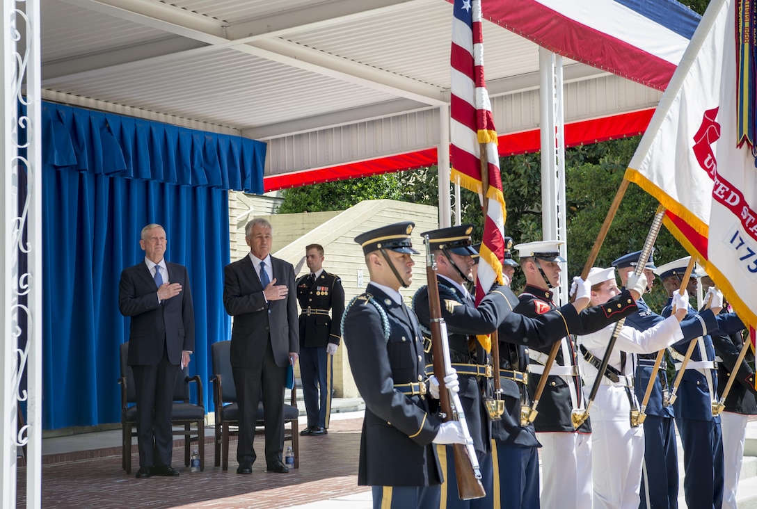 Defense Secretary Jim Mattis and former Defense Secretary Chuck Hagel stand for the national anthem at the unveiling ceremony for Hagel’s official Pentagon portrait in Washington, May 19, 2017. Hagel served as the 24th Secretary of Defense from February 2013 to February 2015. DOD photo by Air Force Tech. Sgt. Brigitte N. Brantley