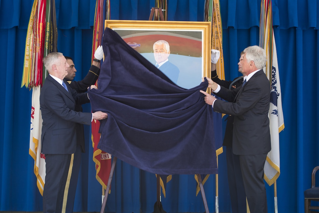 Defense Secretary Jim Mattis and former Defense Secretary Chuck Hagel unveil Hagel’s official Pentagon portrait during a ceremony in Washington, May 19, 2017. Hagel served as the 24th Secretary of Defense from February 2013 to February 2015. DoD photo by Air Force Tech. Sgt. Brigitte N. Brantley