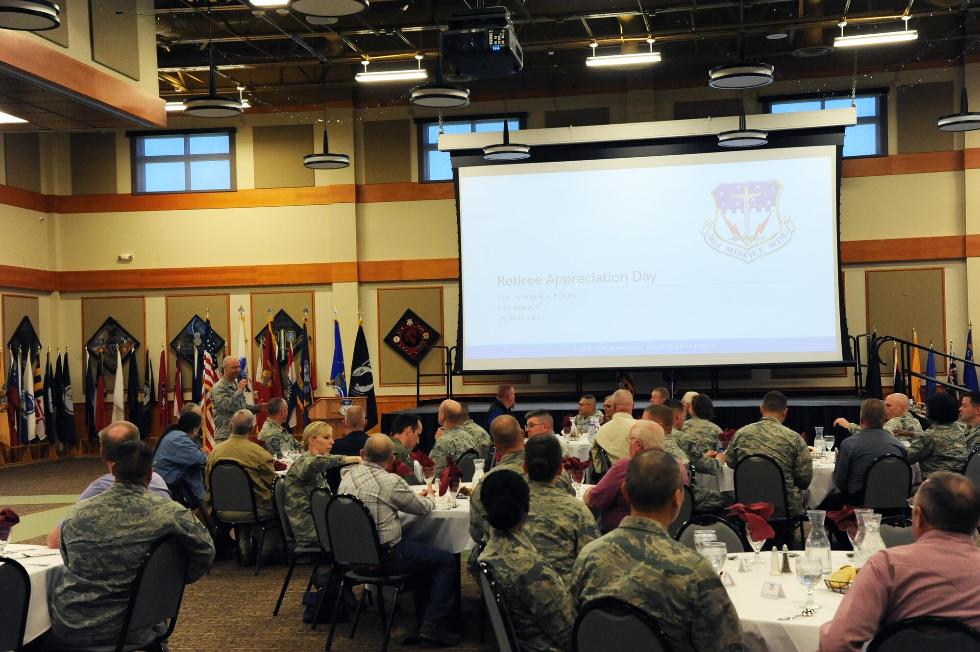 Col. Jay Folds, 341st Missile Wing vice commander, provides Airmen and military retirees from around Montana an update on the future of the base during a retiree appreciation luncheon at Malmstrom Air Force Base, Mont. The event was part of the wing’s annual retiree appreciation day held May 19, 2017. (U.S. Air Force photo/Christy Mason)