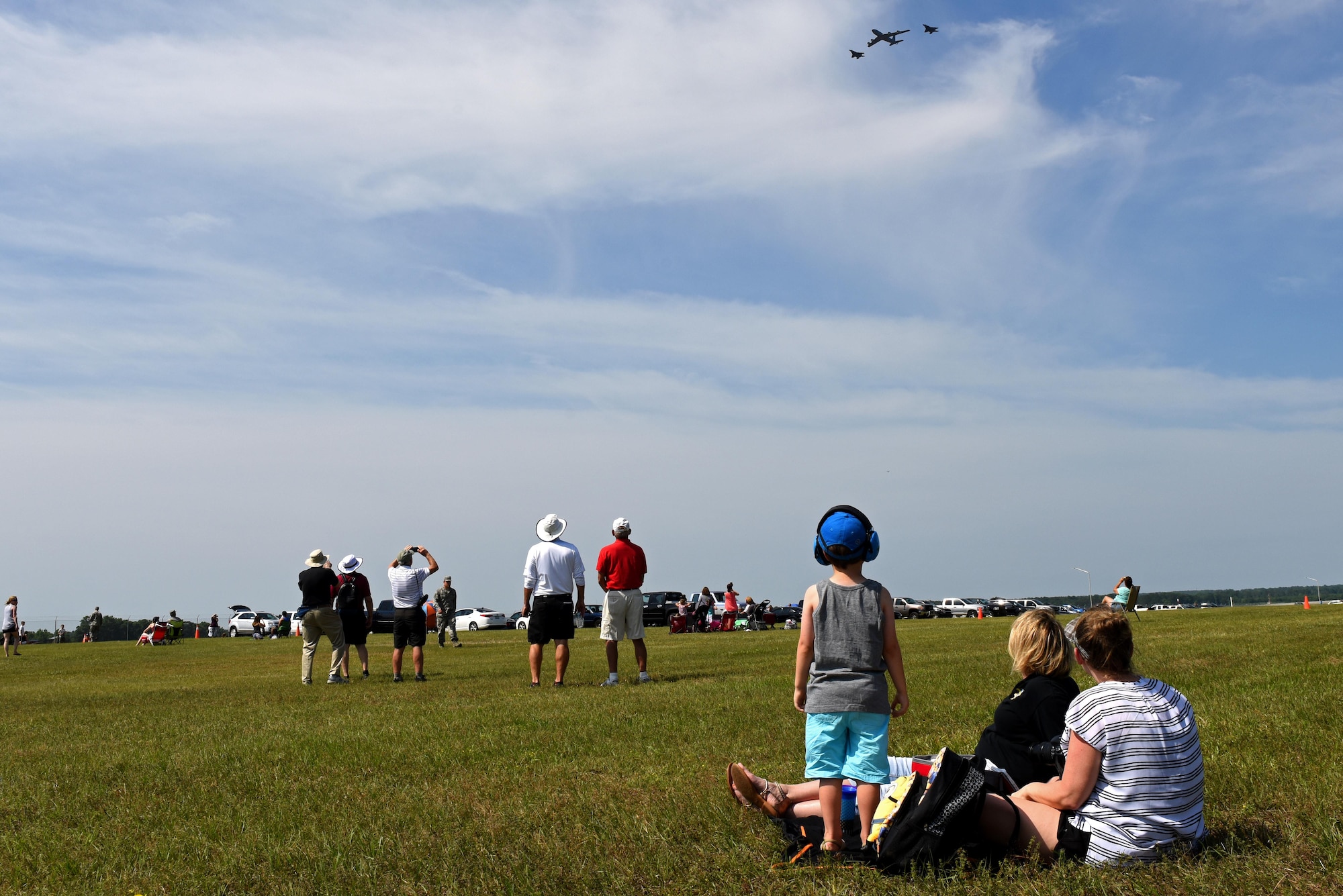 Members of Team Seymour observe a practice air show, May 19, 2017, during a dry-run at Seymour Johnson Air Force Base, North Carolina. In preparation of the Wings Over Wayne 2017 Air Show, all Department of Defense members and their families were invited to attend the performers’ practice runs. (U.S. Air Force photo by Senior Airman Ashley Maldonado)