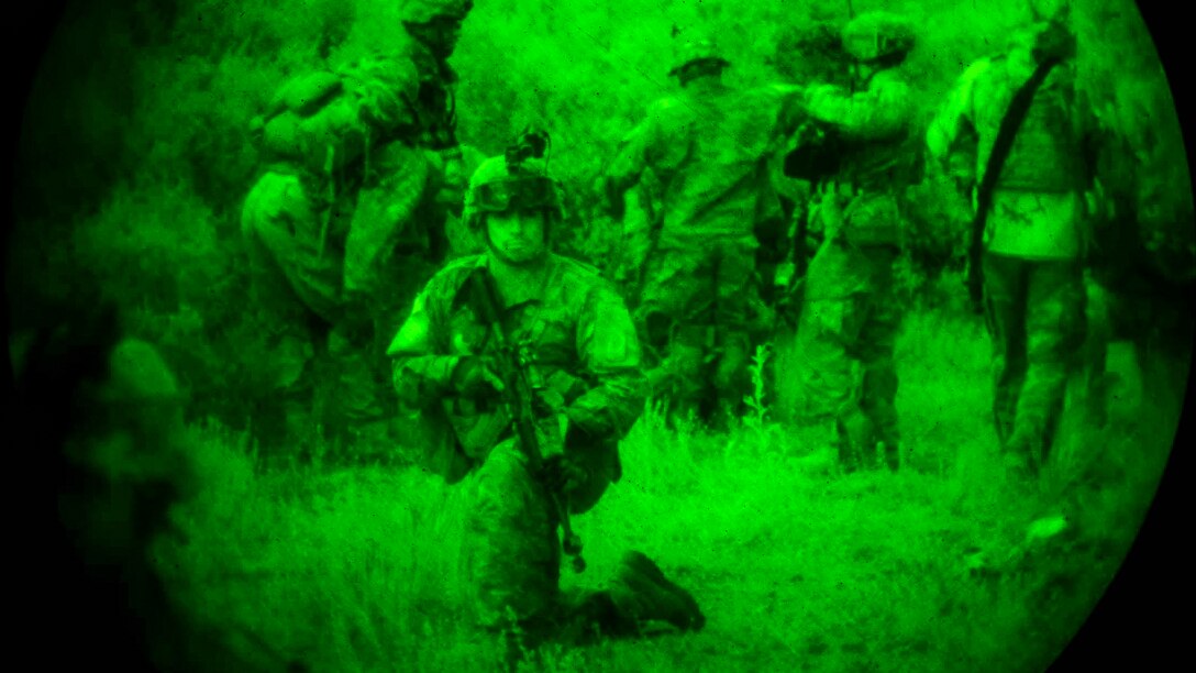 U.S. soldiers and Greek service members execute a simulated night raid during exercise Bayonet-Minotaur near Thessaloniki, Greece, May 17, 2017. The bilateral exercise aims to enhance interoperability and develop individual technical skills. Army photo by Graigg Faggionato