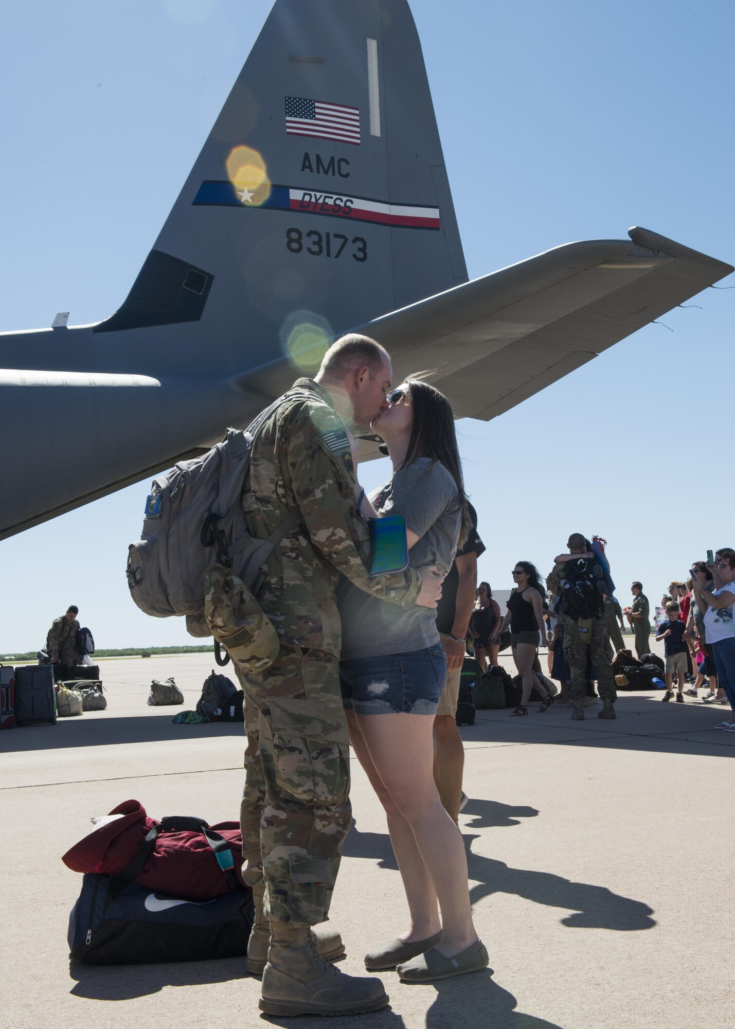 Airman 1st Class Mark Good, 39th Airlift Squadron C-130J Super Hercules crew chief, kisses his girlfriend, Amy, after returning home from a four-month deployment in Afghanistan at Dyess Air Force Base, Texas, May 17, 2017. Crew chiefs ensure the aircrafts are operative and request additional help from maintenance Airmen to fix specific issues as they occur. (U.S Air Force photo by Airman 1st Class Katherine Miller)