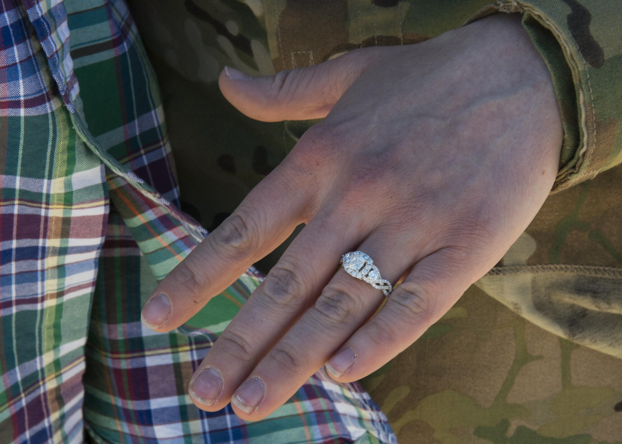 U.S. Air Force Senior Airman Samantha Masten, 39th Airlift Squadron loadmaster, displays her engagement ring after her boyfriend of two years, Allen Diffenbaugh, proposed to her at Dyess Air Force Base, Texas, May 17, 2017. Diffenbaugh planned for family and friends to display a sign reading, “Will you marry me?” as Masten returned from her deployment. (U.S Air Force photo by Airman 1st Class Katherine Miller)