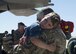 U.S. Air Force Capt. Geoffrey Britzke, 39th Airlift Squadron C-130J Super Hercules pilot, embraces his son after a four-month deployment to Afghanistan at Dyess Air Force Base, Texas, May 17, 2017. Family and friends expressed their excitement and eagerness by holding up signs and exchanging hugs and kisses once their loved ones landed and exited the planes. (U.S Air Force photo by Airman 1st Class Katherine Miller)