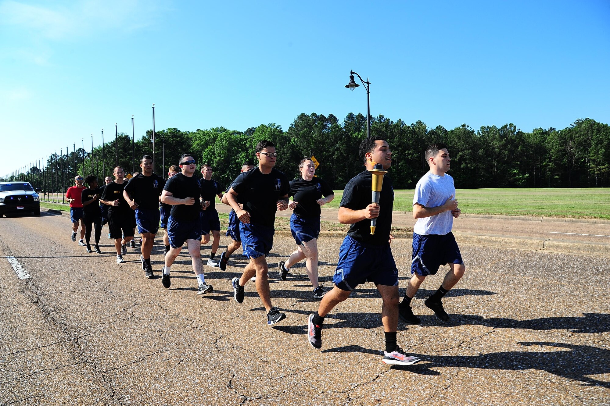 The 14th Security Forces Squadron participates in the 2017 Special Olympics Torch Run May 16, 2017, at Columbus Air Force Base, Mississippi. The Defenders ran two miles through the base and then passed the torch to the Columbus Police Department who then ran the torch through the city of Columbus. (U.S. Air Force photo by Airman 1st Class Beaux Hebert)