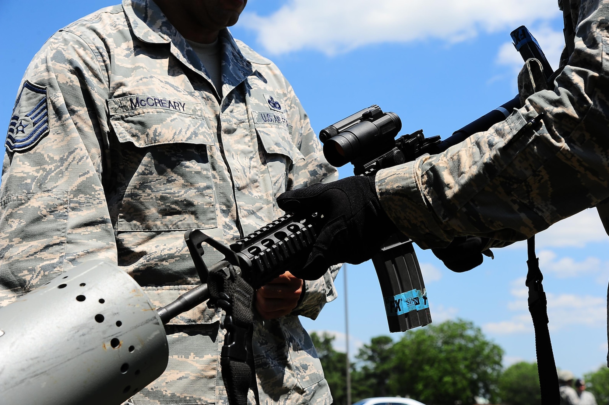 Master Sgt. Jeffery McCreary, 14th Security Forces Squadron Superintendent of Installation Security, observes Airman Lucas McWhorter, 14th SFS Installation Entry Controller, as he clears his weapon May 16, 2017, at Columbus Air Force Base, Mississippi. Defenders are trained on weapon safety and handling  and are permitted to carry weapons on base while on duty. (U.S. Air Force photo by Airman 1st Class Beaux Hebert)