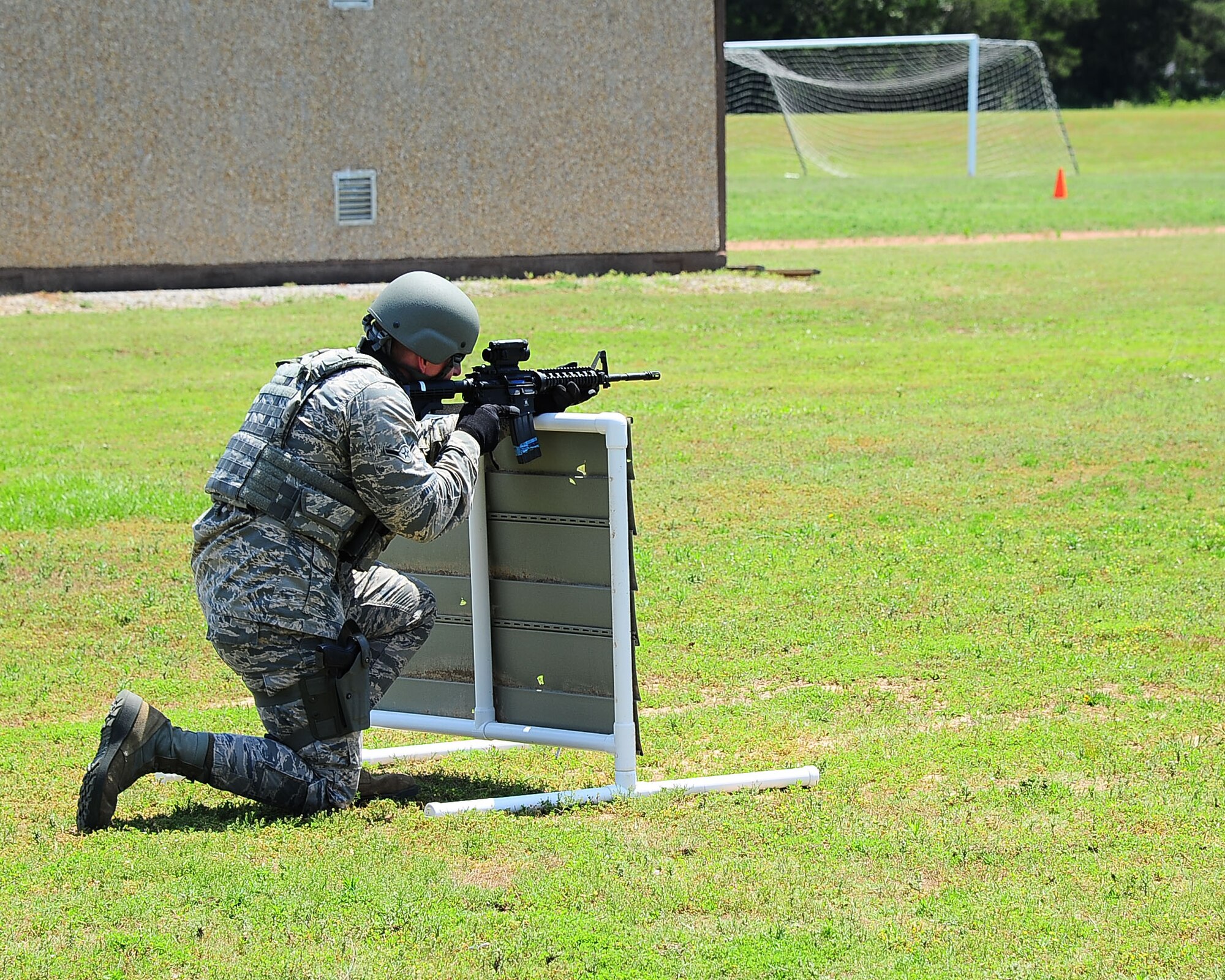 Airman Lucas McWhorter, 14th Security Forces Squadron Installation Entry Controller, participates in the Shoot, Move, Communicate drill May 16, 2017, at Columbus Air Force Base, Mississippi. Defenders use simulation rounds instead of live ammunition during the drill in order to make the training course more safe. (U.S. Air Force photo by Airman 1st Class Beaux Hebert)