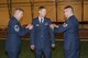 Senior Master Sgt. Patrick Kincaid, 4th Space Operations Squadron superintendent, and Tech. Sgt. William Farrington (right), 3 SOPS training flight chief, recognize Senior Airman Justin Yeager (center), 3rd Space Operations Squadron Wideband Global Satellite Communications satellite vehicle operator, for completing Airman Leadership School and promoting to staff sergeant during the last uniform inspection of 3 SOPS at Schriever Air Force Base, Colorado, Friday, May 12, 2017. 3 SOPS activated at Schriever Air Force base in 1990 and will be officially absorbed into 4 SOPS in June. (U.S. Air Force photo/Staff Sgt. Christopher Moore)