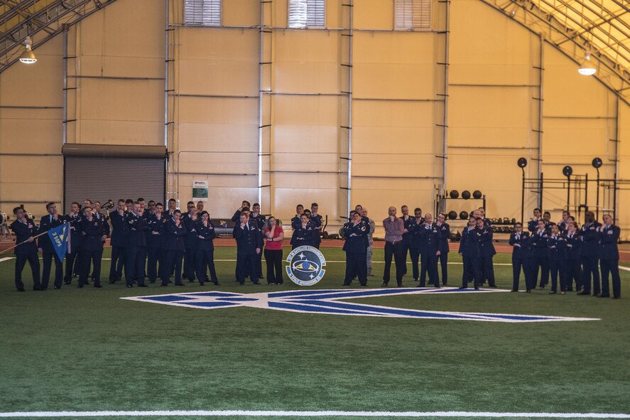 The 3rd Space Operations Squadron gathers to reenact humorous poses from previous squadron photographs during its final uniform inspection before it stands down next month at Schriever Air Force Base, Colorado, Friday, May 12, 2017. The mission of 3 SOPS has been to ensure reliable space-borne communications to national authorities, U.S. and allied forces. (U.S. Air Force photo/Staff Sgt. Christopher Moore)