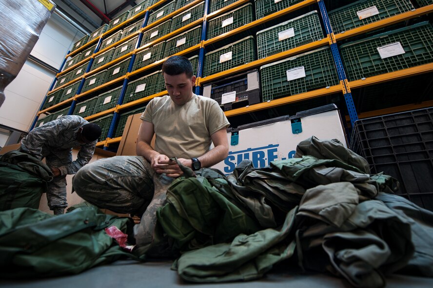 Airman Austin Smith, 86th Logistics Readiness Squadron fuels journeyman, right, and Airman 1st Class Adam Evans III, 86th LRS individual protective equipment journeyman, inventory equipment at the IPE warehouse on Ramstein Air Base, Germany, May 19, 2017. IPE is responsible for maintaining equipment that is used to protect Airmen from chemical, biological, radiological, nuclear and explosive materials. (U.S. Air Force photo by Senior Airman Devin Boyer)