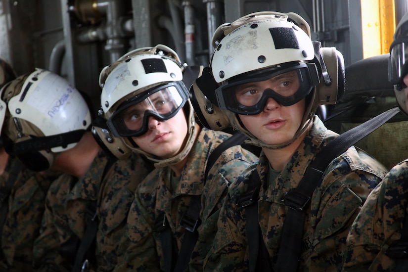 Pfc. Jason Gautreaux (left) and Lance Cpl. Mitch Gautreaux sit together on a CH-53E Super Stallion preparing to fly from Marine Corps Air Station New River, N.C. to Marine Corps Air Station Cherry Point, N.C., May 16, 2017. Both Marines will soon be assigned to units in close proximity to one another after graduating from Squadron Intelligence Training Certification Course. Jason will be assigned to Marine Light Attack Helicopter Squadron 267 at Marine Corps Base Camp Pendleton, California, and Mitch will be assigned to Marine Heavy Helicopter Squadron 465 at Marine Corps Air Station Miramar, California. (U.S. Marine Corps photo by Cpl. Mackenzie Gibson/Released)