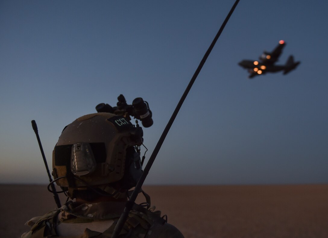 A U.S. Air Force Special Tactics combat controller with the 24th Special Operations Wing maintains visuals on an Ohio Air National Guard 127th Airlift Wing C-130H Hercules during an airfield reconn mission during Exercise Eager Lion May 16, 2017, in Jordan. Special Tactics teams can assess, open, and control major airfields to clandestine dirt strips in either permissive or hostile locations, providing strategic access for U.S. or allied partners. (U.S. Air Force photo by Senior Airman Ryan Conroy) 