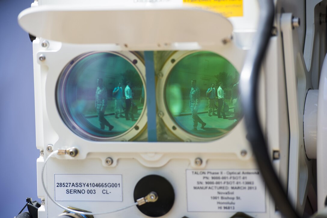 Lenses from an optical data transmission device reflect people attending DoD Lab Day at the Pentagon, May 18, 2017. DoD photo by EJ Hersom