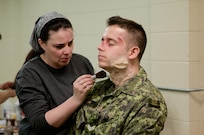 Special effects makeup artist Jenni MacDonald applies prosthetic wounds to a role player who will act as a simulated casualty on a training mission as part of Maple Resolve 17, the Canadian Army's premiere brigade-level validation exercise running May 14-29 at Camp Wainwright, Alberta, Canada. The role players fulfill an integral part for the training, allowing the Soldiers to react to life-like, real-time situations ranging from medevac, hostile enemies and media engagements.

As a part of the exercise, the U.S. Army is providing a wide array of combat and support elements. These elements include sustainment, psychological operations, public affairs, aviation and medical units. Readiness is the U.S. Army Reserve's number one priority. Reserve units participating in Maple Resolve 17 will sharpen individual skill sets while enhancing overall unit readiness.
