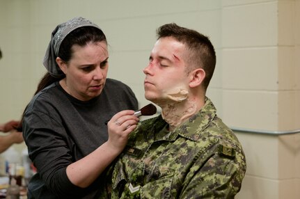 Special effects makeup artist Jenni MacDonald applies prosthetic wounds to a role player who will act as a simulated casualty on a training mission as part of Maple Resolve 17, the Canadian Army's premiere brigade-level validation exercise running May 14-29 at Camp Wainwright, Alberta, Canada. The role players fulfill an integral part for the training, allowing the Soldiers to react to life-like, real-time situations ranging from medevac, hostile enemies and media engagements.

As a part of the exercise, the U.S. Army is providing a wide array of combat and support elements. These elements include sustainment, psychological operations, public affairs, aviation and medical units. Readiness is the U.S. Army Reserve's number one priority. Reserve units participating in Maple Resolve 17 will sharpen individual skill sets while enhancing overall unit readiness.