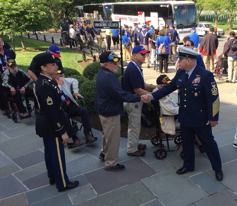 Master Chief Petty Officer of the Coast Guard Steven W. Cantrell meets a Korean War veteran from Midland, Texas, at the Memorial Amphitheater in Arlington National Cemetery, Va., May 20, 2017. DoD photo by Jim Garamone