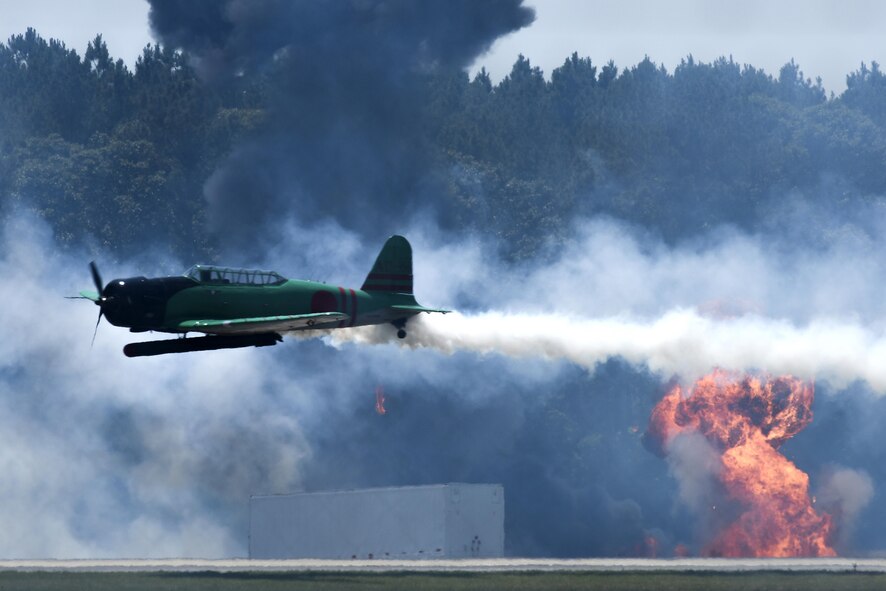Aircraft part of the “Tora! Tora! Tora!” performance re-create the attack on Pearl Harbor during the Wings Over Wayne Air Show, May 20, 2017, at Seymour Johnson Air Force Base, North Carolina. The Tora show includes more than 60 pyrotechnic effects to simulate the bombings that signaled the beginning of American involvement in World War II. (U.S. Air Force photo by Staff Sgt. Brittain Crolley)