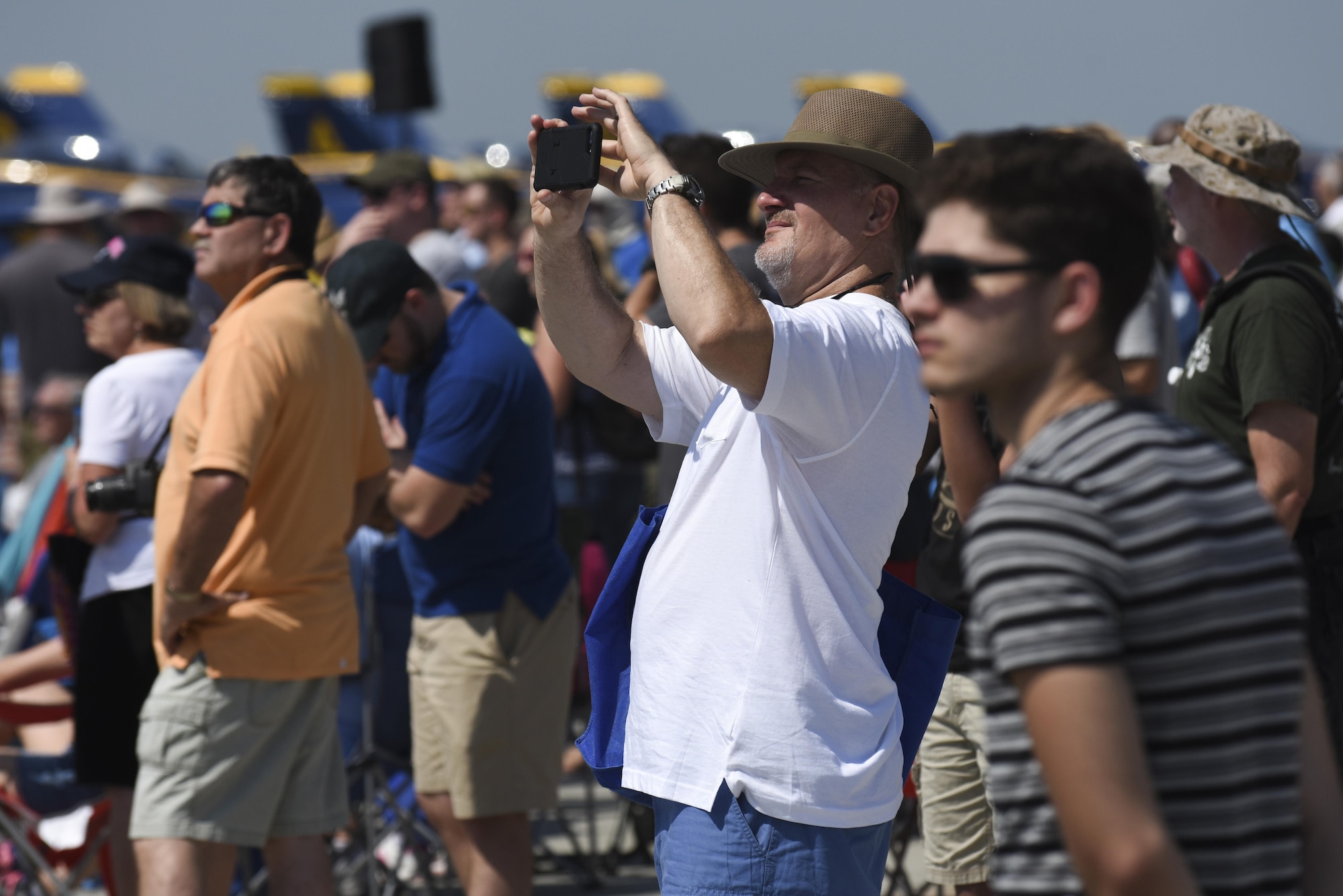 Attendees of the Wings Over Wayne Air Show watch aerial performances, May 20, 2017, at Seymour Johnson Air Force Base, North Carolina. Seymour Johnson AFB opened its gates to the public for a free, two-day event as a way to thank the local community for their ongoing support of the base’s mission. (U.S. Air Force photo by Staff Sgt. Brittain Crolley)