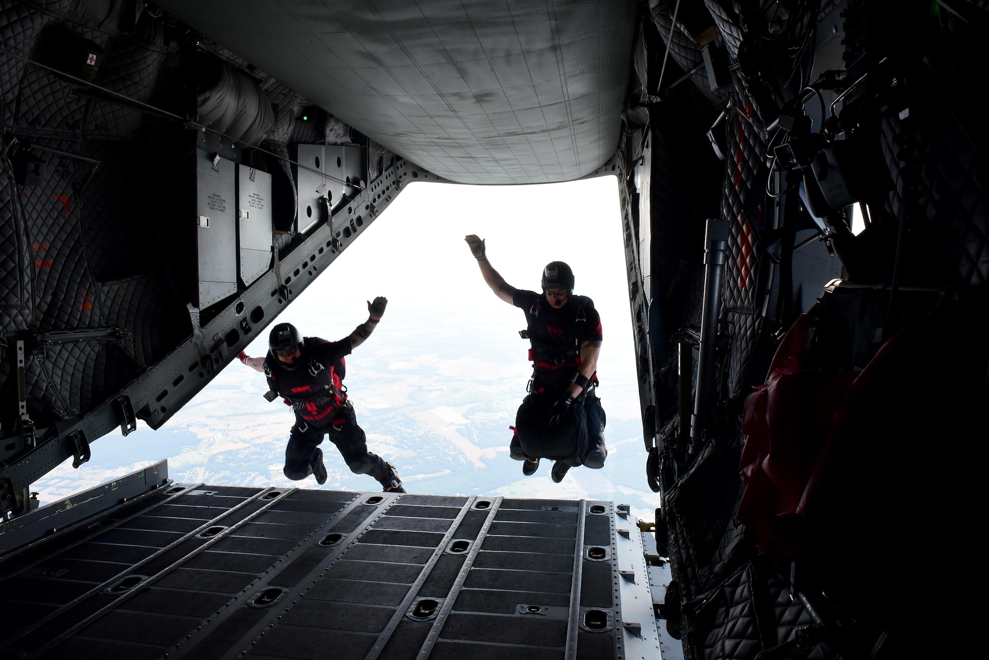 Members of the Black Daggers, the official U.S. Army Special Operations Command Parachute Demonstration Team, jump from an aircraft during the Wings Over Wayne Air Show, May 20, 2017, in the skies over Seymour Johnson Air Force Base, North Carolina. The 4th Fighter Wing at Seymour Johnson AFB will celebrate their 75th anniversary in September 2017. (U.S. Air Force photo by Airman 1st Class Kenneth Boyton)