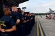 Members of the U.S. Navy Blue Angels stand in formation during a hangar party the day before the Wings Over Wayne Air Show, May 19, 2017, at Seymour Johnson Air Force Base, North Carolina. The air show is a free, two-day event that featured more than 21 aerial demonstrations, aircraft static displays, military working dog demonstrations and other events. U.S. Air Force photo by Airman 1st Class Kenneth Boyton)