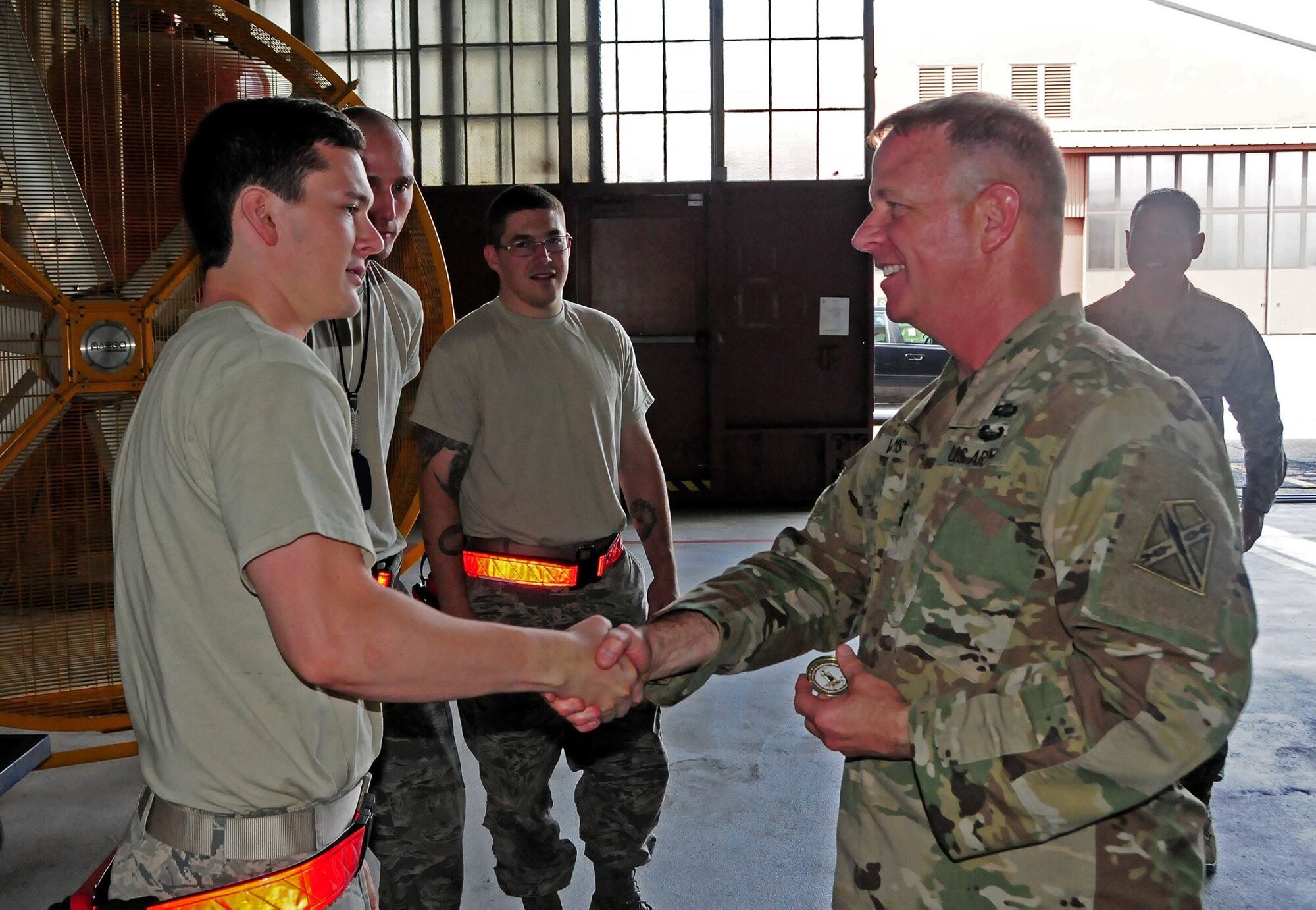 Maj. Gen. Timothy P. Williams, the Adjutant General of Virginia met with members from the 192nd Fighter Wing Maintenance Group at Joint Base Langley-Eustis, Virginia April 22, 2017. During his visit, Williams viewed the launch of an F-22 Raptor, observed a weapons load training event, listened to concerns and ideas from both Maintenance and Aircraft Maintenance Squadron Airmen, was briefed on current and future operations, and took the opportunity to recognize several Airmen for their accomplishments here by coining them. (U.S. Air National Guard photo by Staff Sgt. Johnisa B. Roberts)