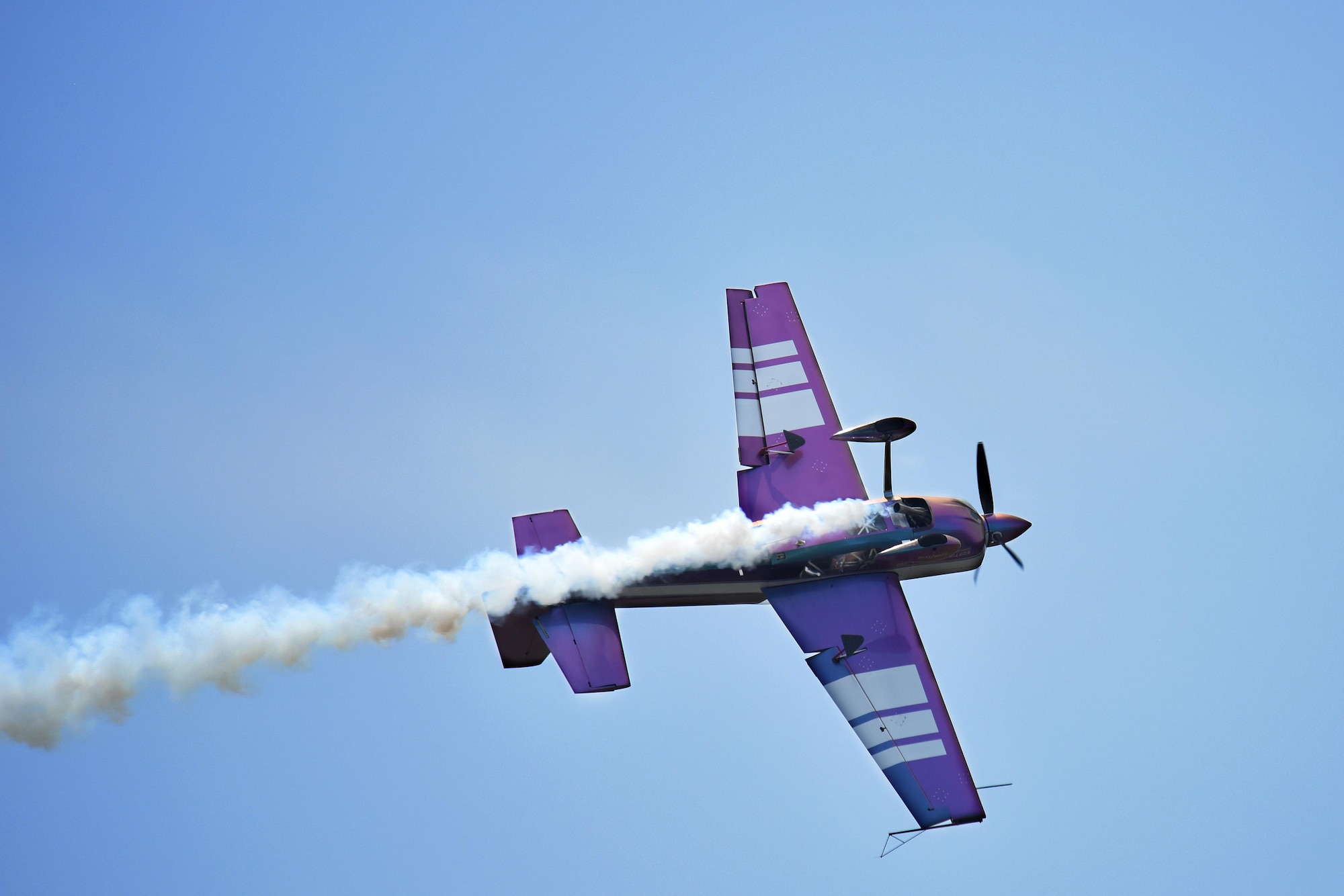 Bill Stein flies his Edge 540 during the Wings Over Wayne Air Show, May 21, 2017, at Seymour Johnson Air Force Base, North Carolina. The Edge 540 is specially painted to change colors depending on the aircraft’s varying angle and lighting. (U.S. Air Force photo by Rank Airman 1st Class Miranda Loera)