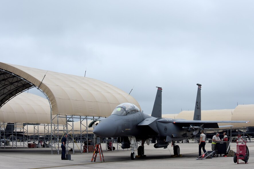 Maintainers ready an F-15E Strike Eagle before it flies during the Wings Over Wayne Air Show, May 21, 2017, at Seymour Johnson Air Force Base, North Carolina. Later this year, the 4th Fighter Wing will celebrate its 75th anniversary with a weekend of heritage events and ceremonies. (U.S. Air Force photo by Airman 1st Class Miranda A. Loera)