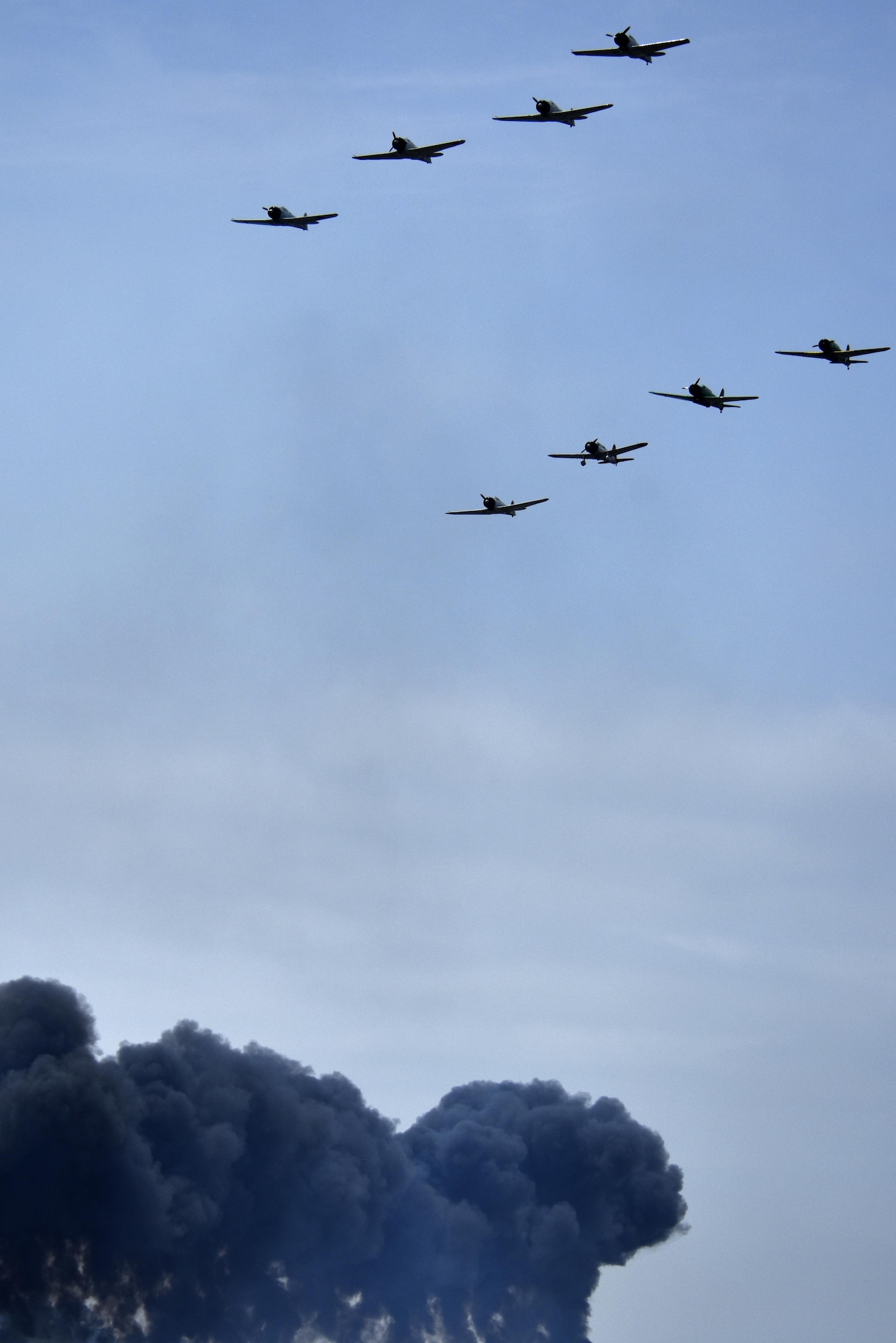 Aircraft part of the “Tora! Tora! Tora!” performance re-create the attack on Pearl Harbor during the Wings Over Wayne Air Show, May 21, 2017, at Seymour Johnson Air Force Base, North Carolina. The Tora show includes more than 60 pyrotechnic effects to simulate the bombings that signaled the beginning of American involvement in World War II. (U.S. Air Force photo by Airman 1st Class Christopher Maldonado)