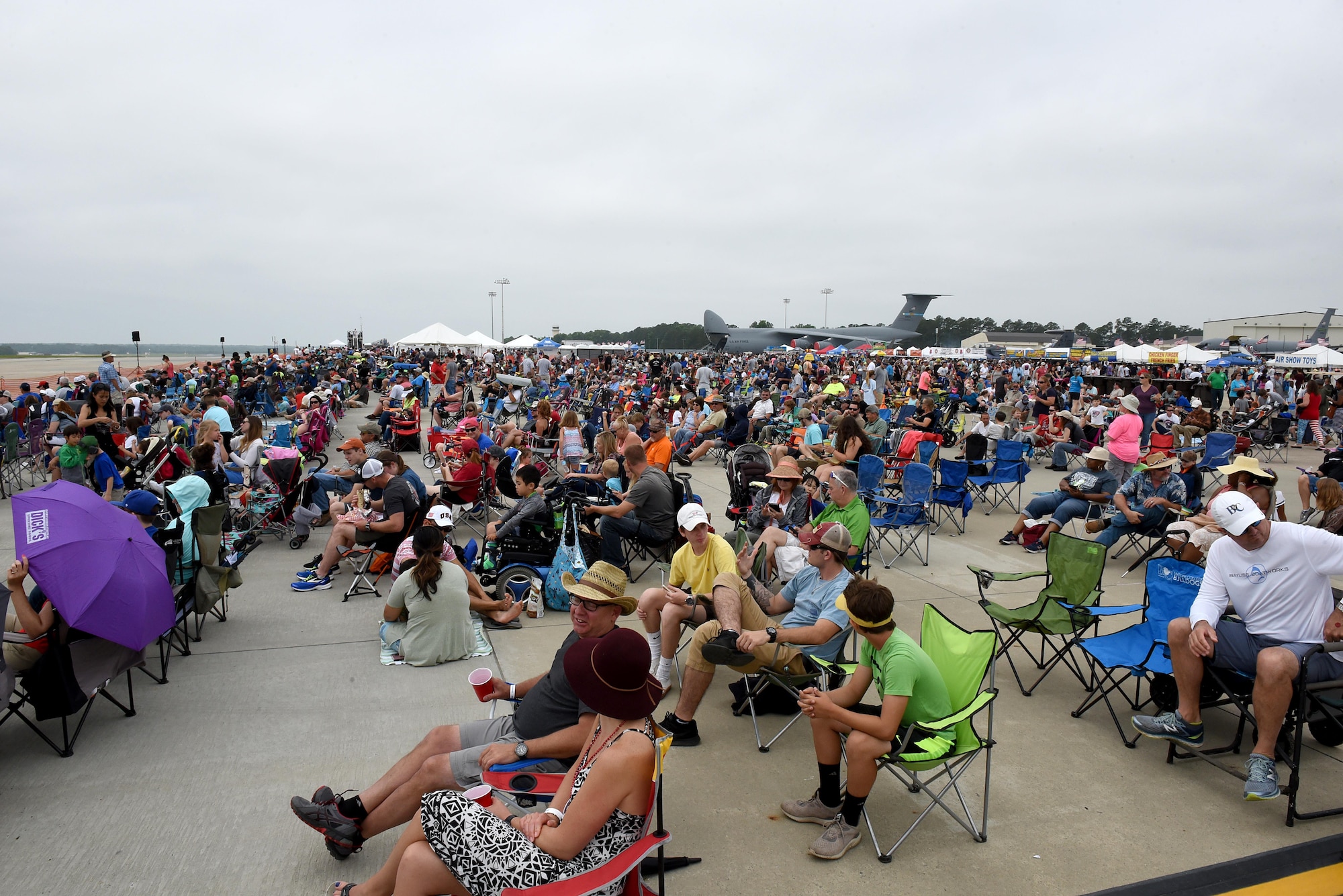 Spectators view multiple aircraft static displays and demonstrations during the Wings Over Wayne Air Show, May 21, 2017, at Seymour Johnson Air Force Base, North Carolina. The U.S. Navy’s premiere aerial demonstration team, the Blue Angels, headlined the free, two-day air show. (U.S. Air Force photo by Airman 1st Class Victoria Boyton)