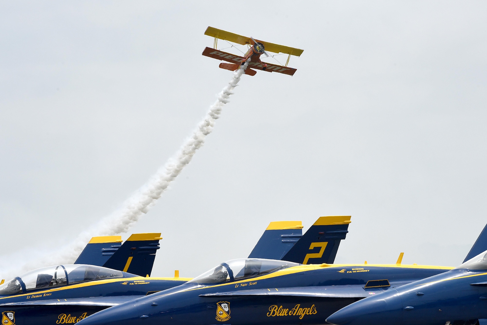 Gene Soucy pilots a Grumman biplane nicknamed “Showcat” over the U.S. Navy Blue Angels aircraft during the Wings Over Wayne Air Show, May 21, 2017, at Seymour Johnson Air Force Base, North Carolina. Soucy began professional airshow flying in 1968. (U.S. Air Force photo by Airman 1st Class Victoria Boyton)