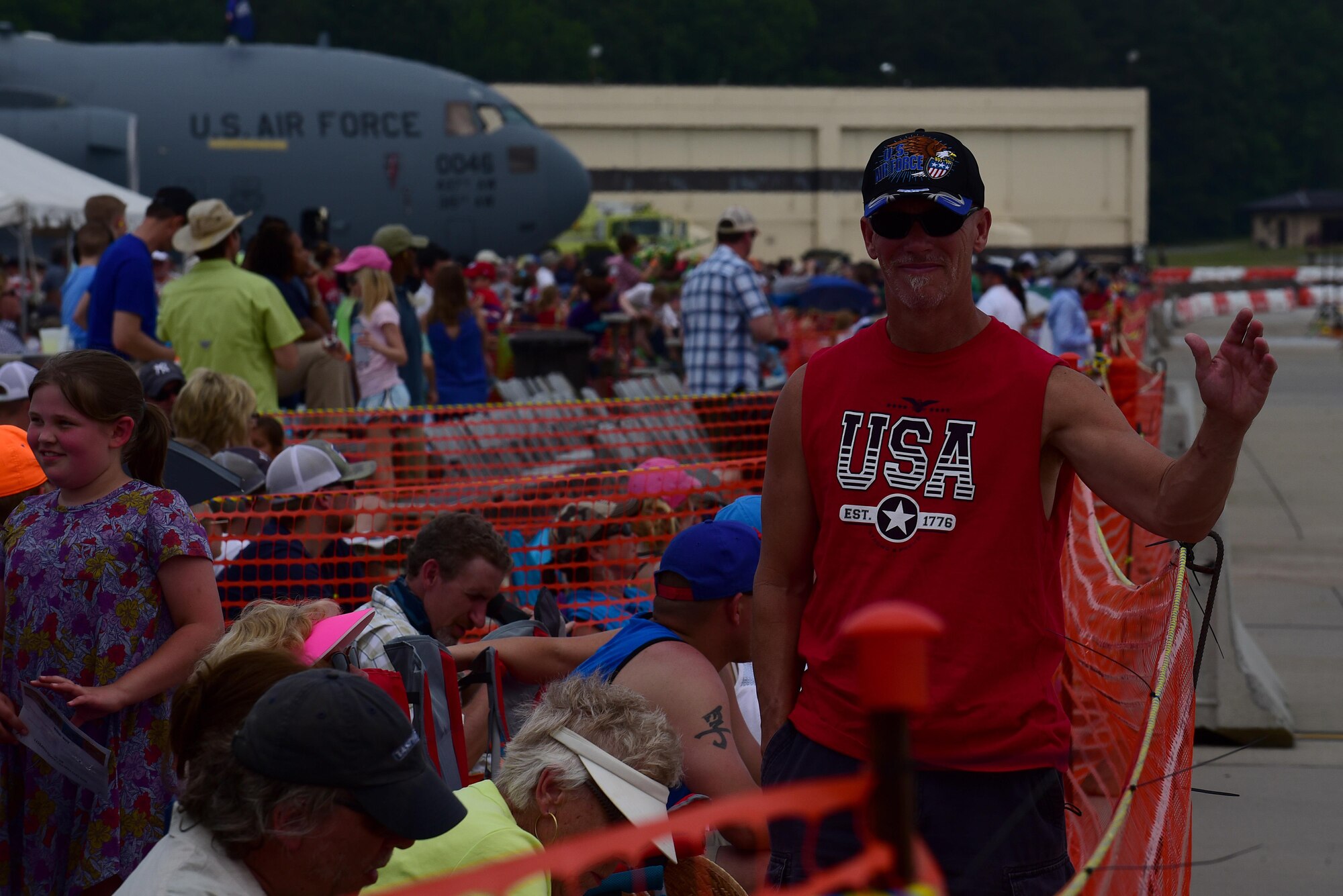 Attendees of the Wings Over Wayne Air Show watch aerial performances overhead, May 21, 2017, at Seymour Johnson Air Force Base, North Carolina. Seymour Johnson AFB opened its gates to the public for a free, two-day event as a way to thank the local community for their ongoing support of the base’s mission. (U.S. Air Force photo by Airman 1st Class Kenneth Boyton)