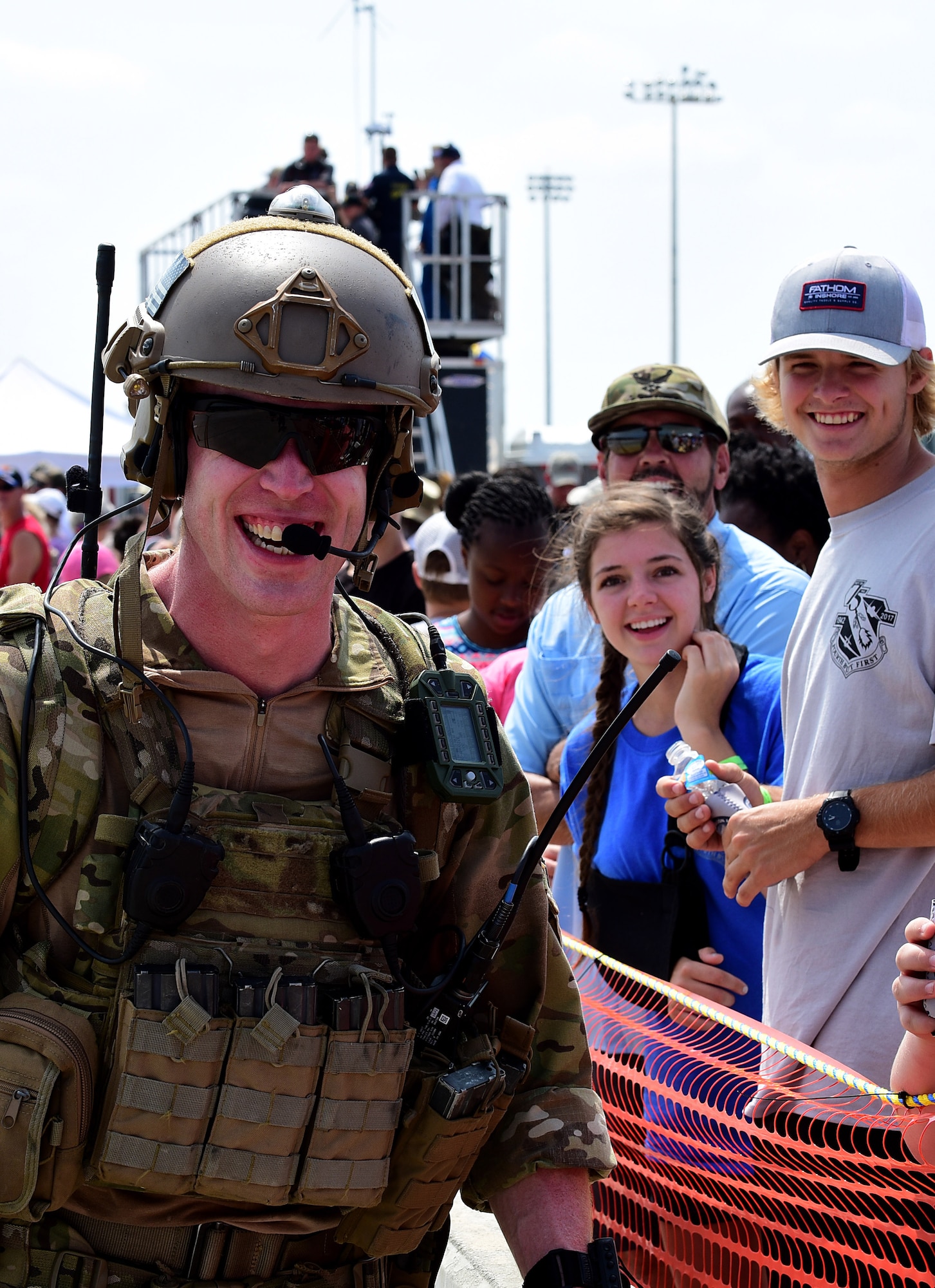 A Joint Terminal Attack Controller takes pictures among the crowd during the Wings Over Wayne Air Show, May 21, 2017, at Seymour Johnson Air Force Base, North Carolina. Seymour Johnson AFB opened its gates to the public for a free, two-day event as a way to thank the local community for their ongoing support of the base’s mission. (U.S. Air Force photo by Airman 1st Class Kenneth Boyton)