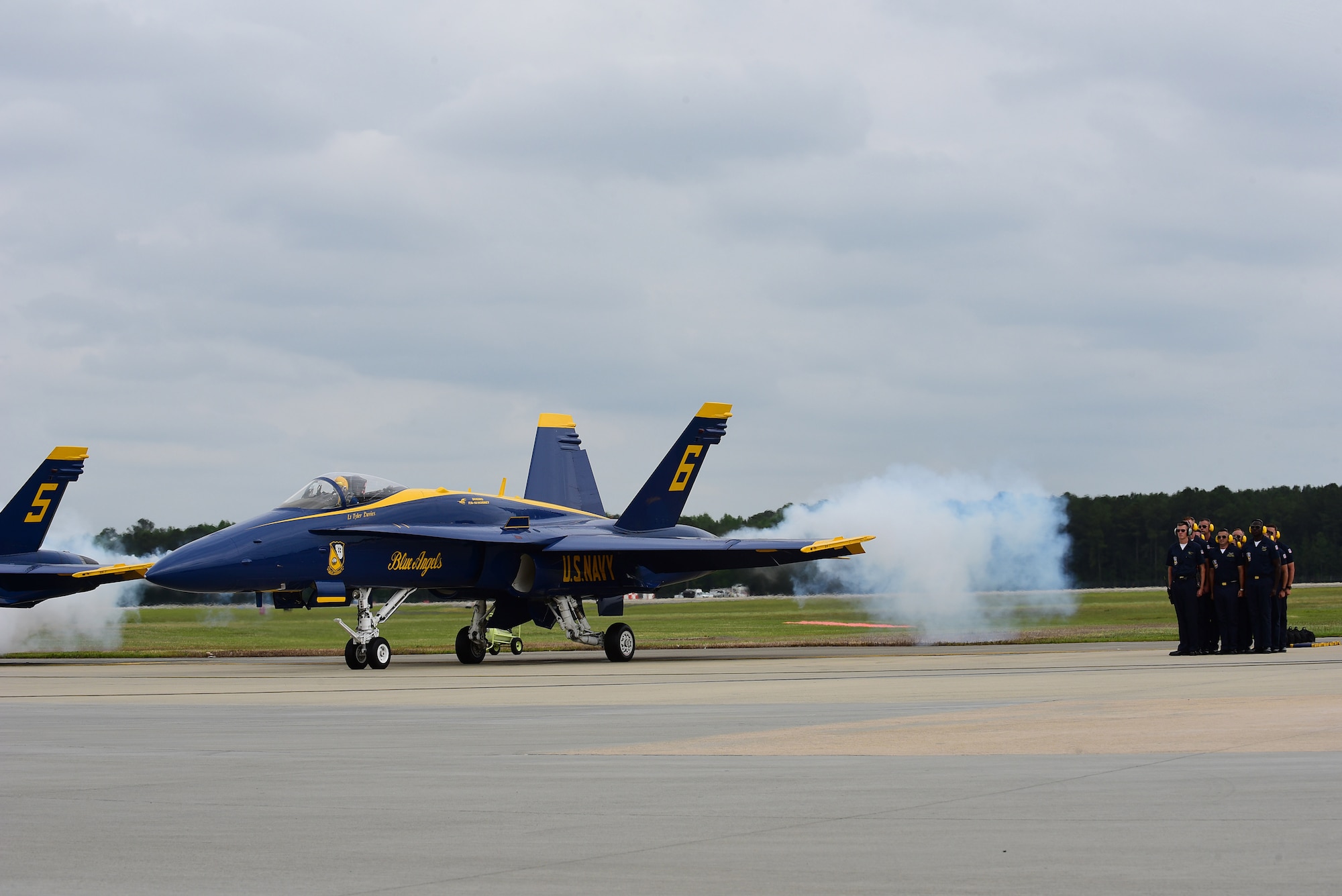 The U.S. Navy Blue Angels prepare to take to the skies over Seymour Johnson Air Force Base, North Carolina, May 21, 2017, during the Wings Over Wayne Air Show. The Blue Angels are the Navy’s premiere aerial demonstration team, led by Commander Ryan J. Bernacchi, the #1 aircraft pilot, flight leader and commanding officer of the 2017 team. (U.S. Air Force photo by Airman 1st Class Kenneth Boyton)