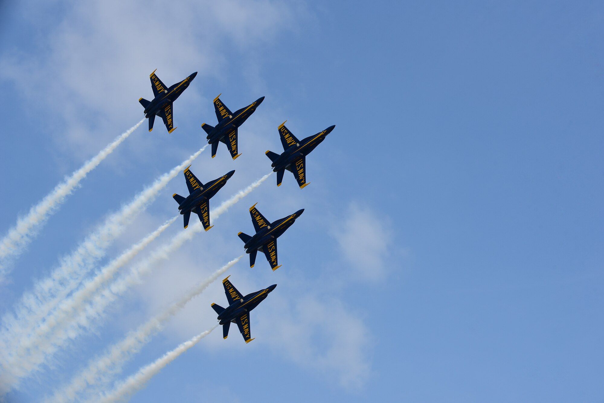 The U.S. Navy Blue Angels fly over Seymour Johnson Air Force Base, North Carolina, May 21, 2017, during the Wings Over Wayne Air Show. The air show was a free, two-day event that featured more than 20 aerial demonstrations, aircraft static displays, military working dog demonstrations and other events. (U.S. Air Force photo by Airman 1st Class Kenneth Boyton)
