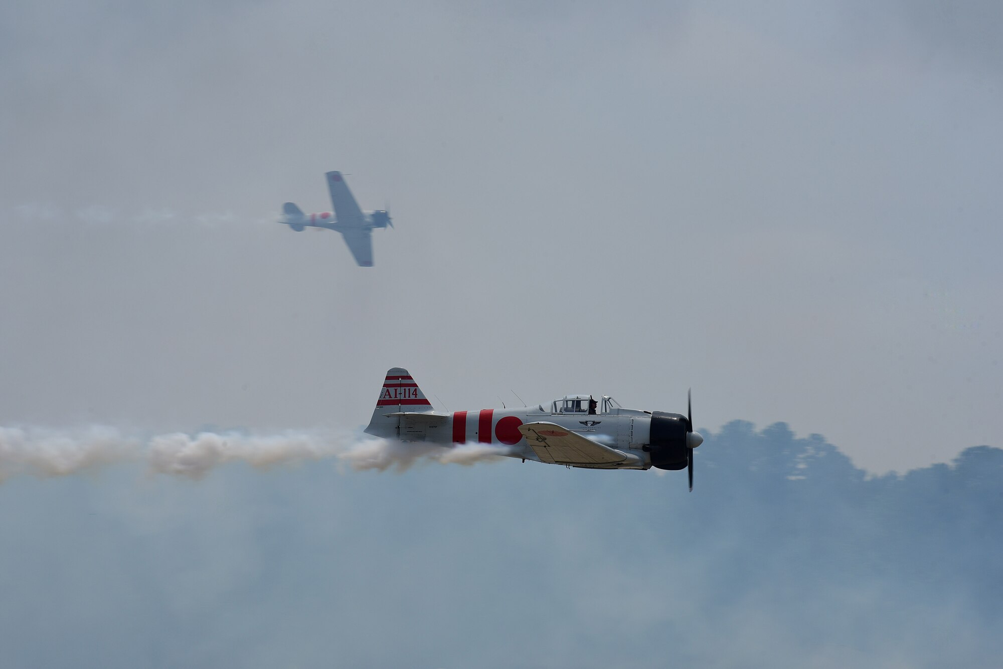 Two Japanese Mitsubishi A6M Zero aircraft perform as part of the "Tora! Tora! Tora!" performance during the Wings Over Wayne Air Show, May 21, 2017, at Seymour Johnson Air Force Base, North Carolina. The air show is a way for Seymour Johnson AFB to thank local and regional communities for their ongoing support. (U.S. Air Force photo by Airman 1st Class Kenneth Boyton)