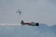 Two Japanese Mitsubishi A6M Zero aircraft perform as part of the 
