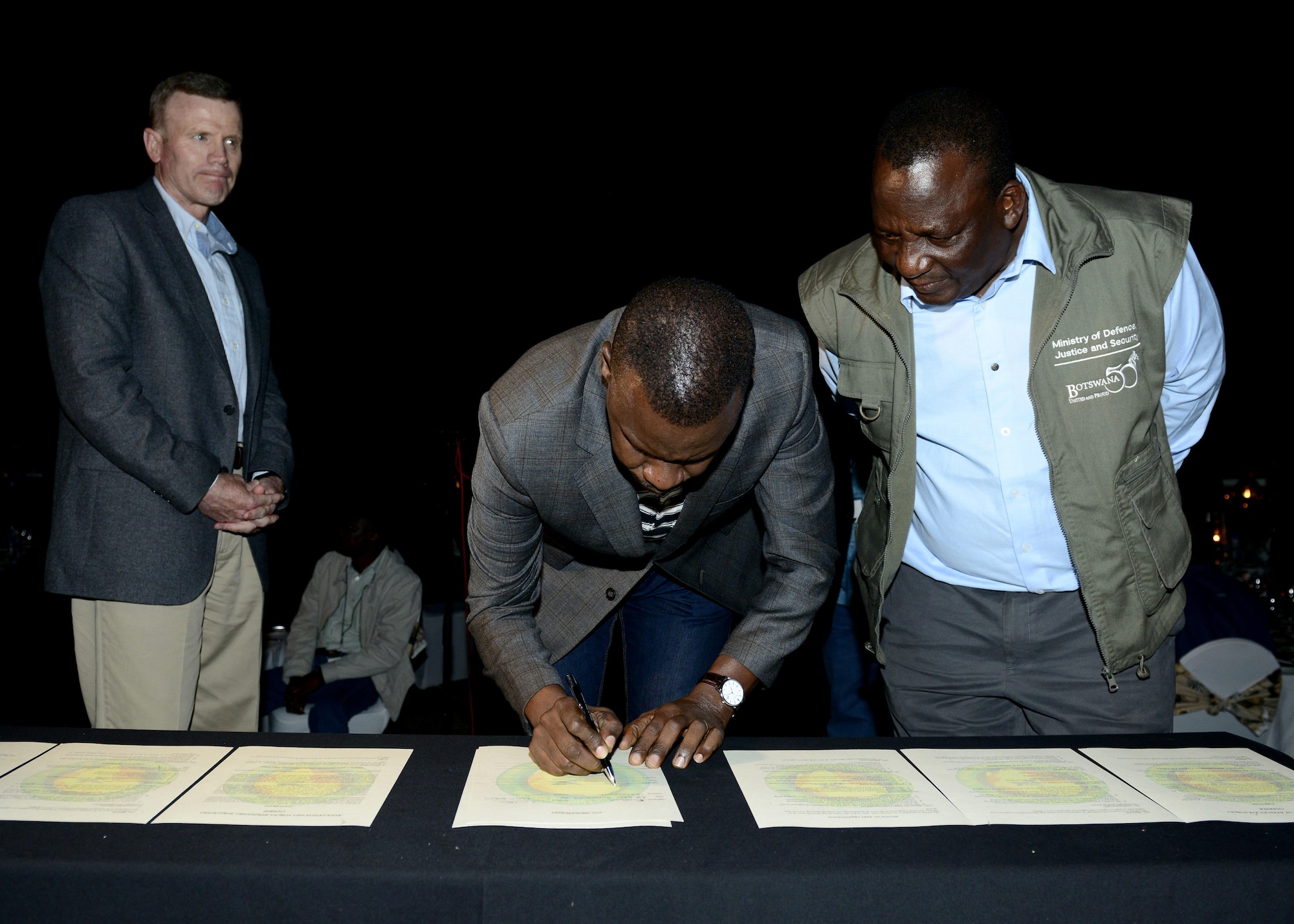 Gen. Tod D. Wolters, U.S. Air Forces in Europe and Africa commander, and Maj. Gen. Innocent S. Phatshwana, Botswana Defense Force Air Arm commander, facilitate a signing of the Association of African Air Chiefs Charter during the closing ceremony of the 2017 African Air Chiefs Symposium in Kasane, Botswana on May 17, 2017. The charter encourages members to seek opportunities to cooperate and collaborate to improve and support air operations across Africa. (U.S. Air Force photo by Staff Sgt. Krystal Ardrey)