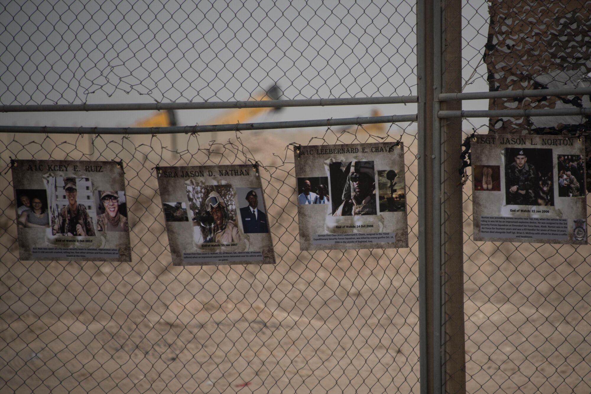 The 386th and 387th Expeditionary Security Forces Squadrons displayed signs honoring the Fourteen security forces members lost during Operations Iraqi Freedom, Enduring Freedom, Freedom's Sentinel and Inherent Resolve during a homerun derby at an undisclosed location in Southwest Asia, May 17, 2017. In remembrance of each individual who gave their lives for their country, their state and their community, members of the 386th, 387th and coalition forces worked together throughout the week to pay their respects to fallen law enforcement officers.  (U.S. Air Force photo/TSgt Jonathan Hehnly)