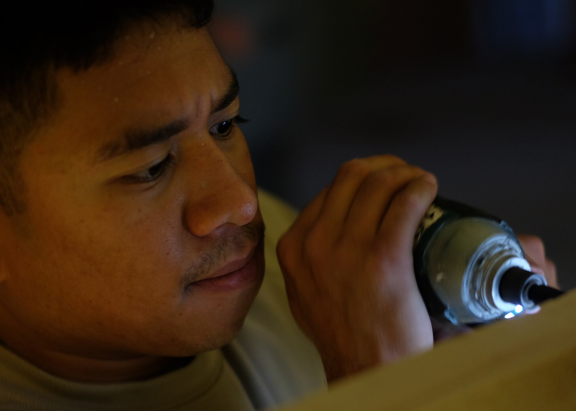 Airman 1st Class El John Julius, 380th Expeditionary Civil Engineer Squadron carpenter, screws together a section of a frame May 16, 2017, at an undisclosed location in southwest Asia. Lumber was used to create new offices for the 727th Expeditionary Air Control Squadron. "I appreciate the opportunities the Air Force provided me through my job," said El John Julius. "I can take the skills I've learned here and make my home a better place." (U.S. Air Force photo by Senior Airman Preston Webb)