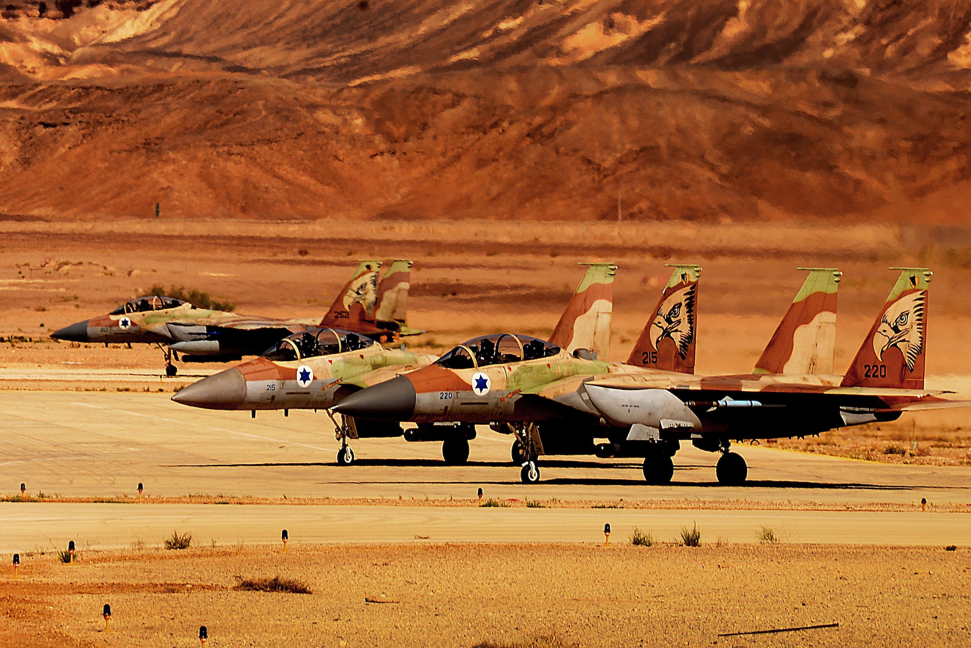 Three F-15I Ra'ams await clearance to launch for a sortie in support of exercise Juniper Falcon May 8, at Uvda Air Base, Israel. Juniper Falcon 17 represents the combination of several bi-lateral component/ Israeli Defense Force exercises that have been executed annually since 2011. These exercises were combined to increase joint training opportunities and capitalize on transportation and cost efficiencies gained by aggregating forces. (U.S. Air Force photo/ Tech. Sgt. Matthew Plew)
