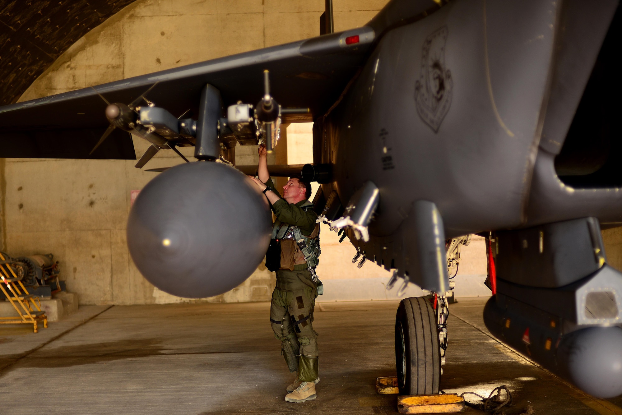 U.S. Air Force Colonel Evan Pettus, 48th Fighter Wing commander, Royal Air Force Lakenheath, England, conducts a pre-flight inspection of his F-15E Strike Eagle in support of exercise Juniper Falcon May 8, at Uvda Air Base, Israel. Pettus flew a training sortie with Israeli air force designed to improve interoperability between U.S. and Israeli air capabilities. (U.S. Air Force photo/ Tech. Sgt. Matthew Plew)